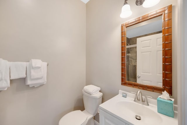 bathroom with toilet and vanity