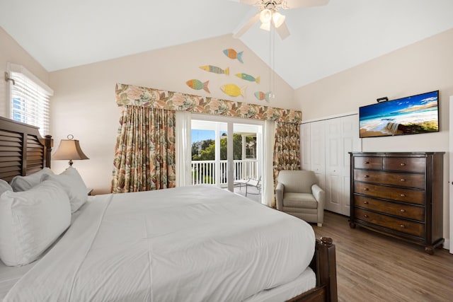 bedroom with access to exterior, ceiling fan, wood-type flooring, a closet, and high vaulted ceiling