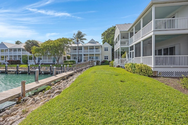 exterior space with a boat dock and a water view