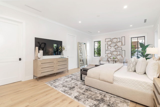 bedroom with light wood-type flooring, ornamental molding, and multiple windows