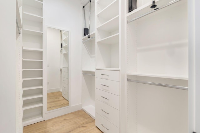 walk in closet featuring hardwood / wood-style floors