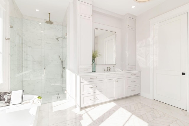 315 Avila Rd, West Palm Beach, FL 33405 - bathroom featuring a marble finish shower, vanity, marble finish flooring, and recessed lighting