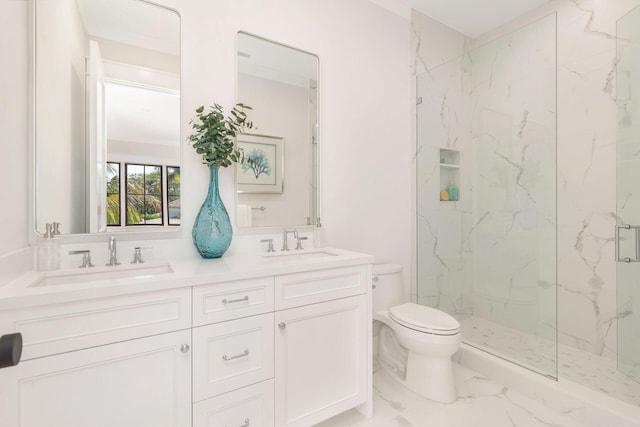 bathroom featuring ornamental molding, vanity, toilet, and a shower with shower door