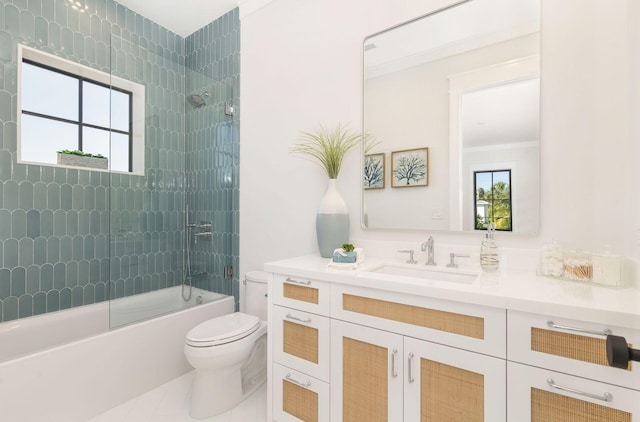 full bathroom featuring vanity, enclosed tub / shower combo, and toilet