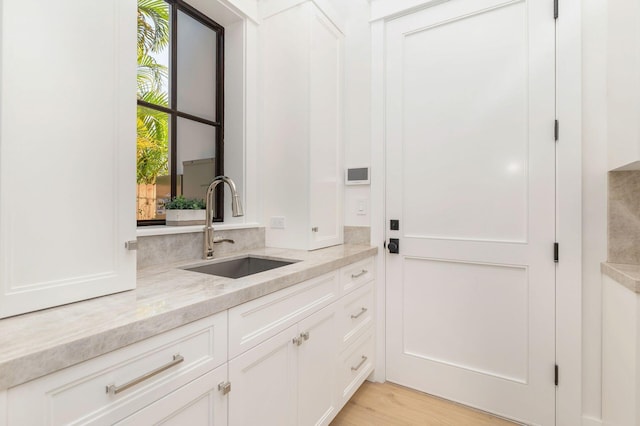 interior space with vanity and hardwood / wood-style flooring