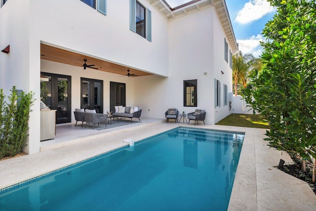 view of pool featuring outdoor lounge area, ceiling fan, and a patio