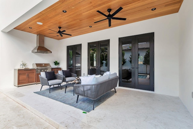 view of patio featuring outdoor lounge area, an outdoor kitchen, a grill, and french doors