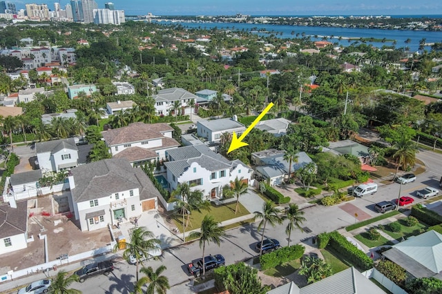 birds eye view of property with a water view