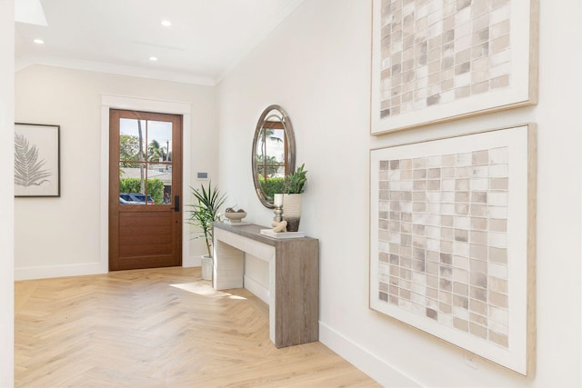 foyer featuring light parquet floors and crown molding