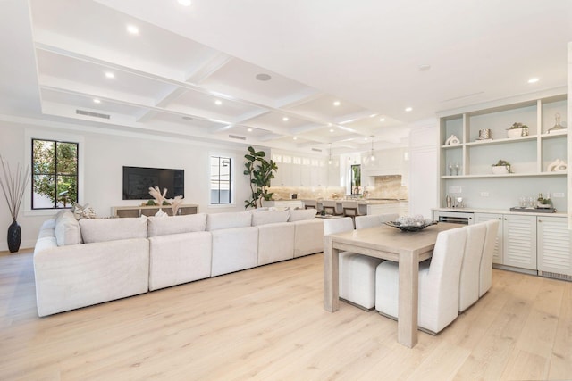 living room featuring beamed ceiling, light wood-type flooring, and coffered ceiling