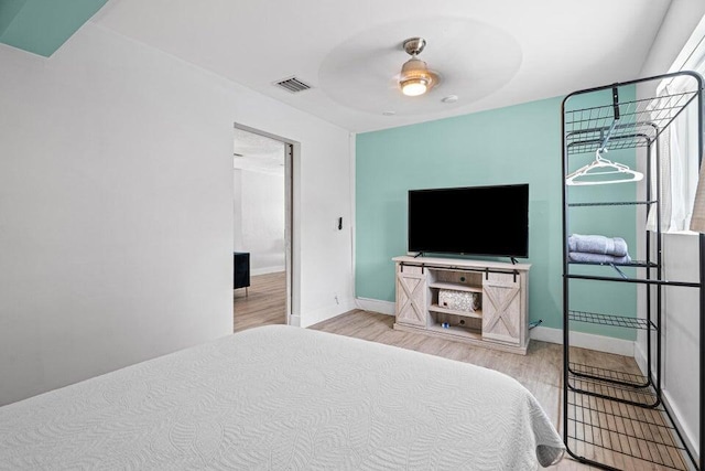 bedroom featuring ceiling fan and light hardwood / wood-style flooring