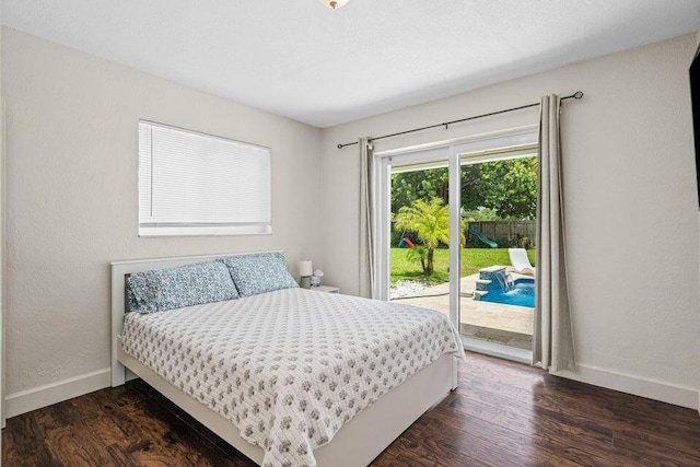 bedroom with dark hardwood / wood-style flooring and access to outside