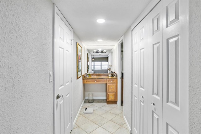 hallway featuring light tile patterned floors