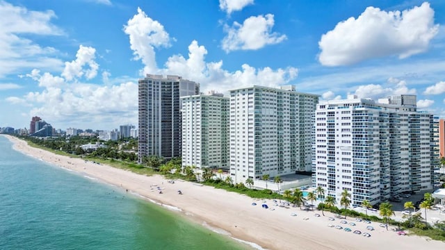 bird's eye view featuring a water view and a view of the beach