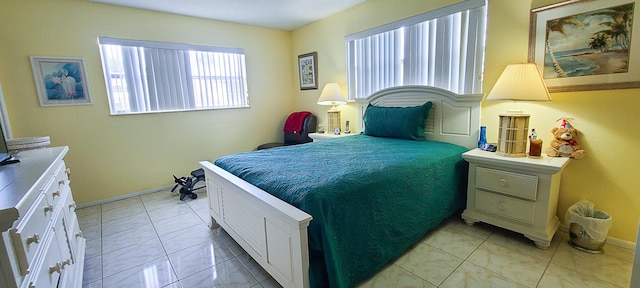 bedroom with light tile patterned floors