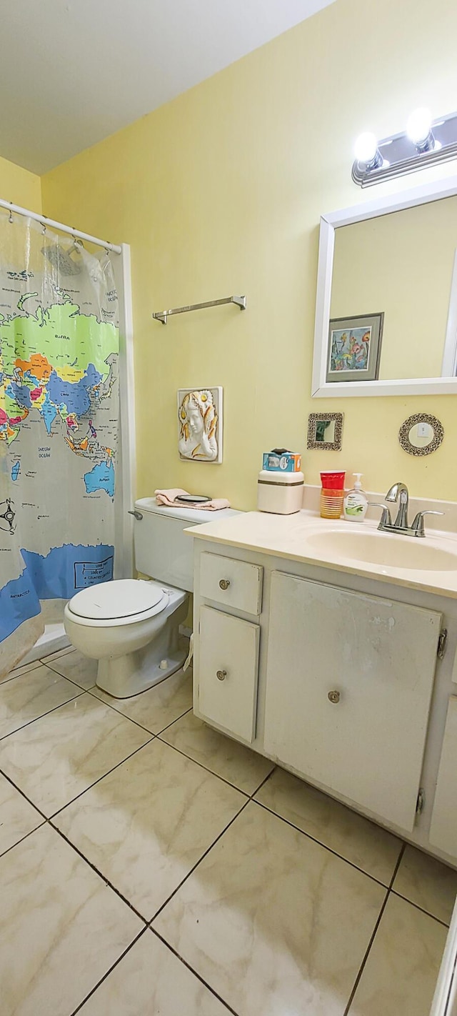 bathroom featuring a shower with curtain, tile patterned flooring, vanity, and toilet