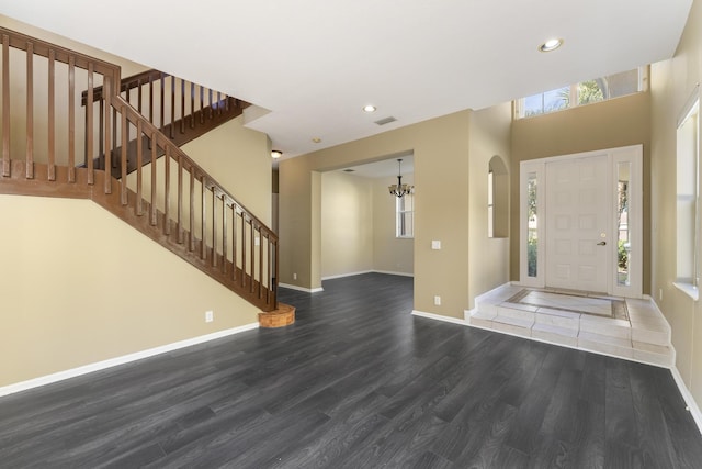 entryway with a wealth of natural light and dark wood-type flooring