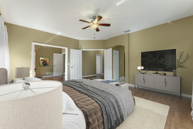 bedroom featuring ceiling fan and wood-type flooring