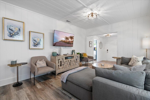 living room featuring hardwood / wood-style floors and a chandelier