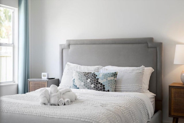 bedroom featuring multiple windows