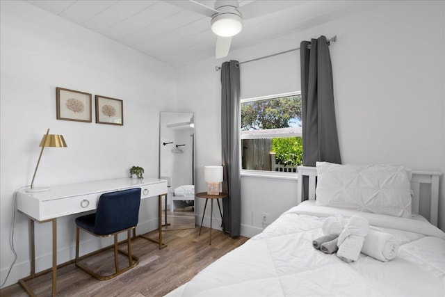 bedroom featuring hardwood / wood-style floors and ceiling fan