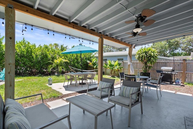 view of patio featuring area for grilling and ceiling fan