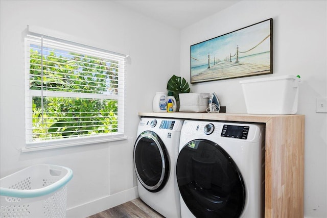 washroom featuring hardwood / wood-style floors and independent washer and dryer