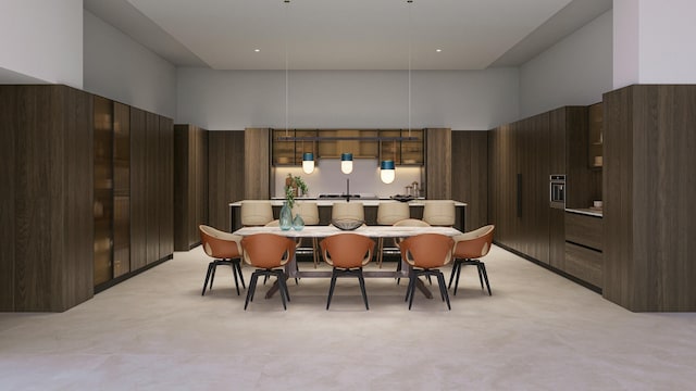 dining area with a towering ceiling