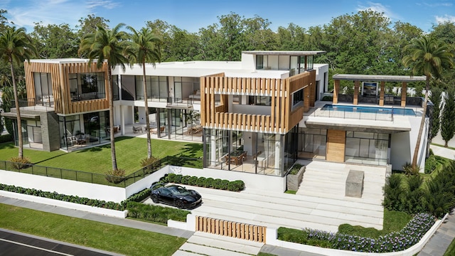 6315 S Flagler Dr, West Palm Beach, FL 33405 - rear view of property featuring an outdoor pool and a patio area
