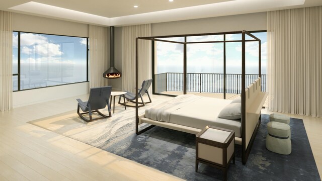 bedroom with access to outside and wood finished floors