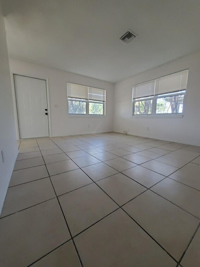 spare room with light tile patterned floors