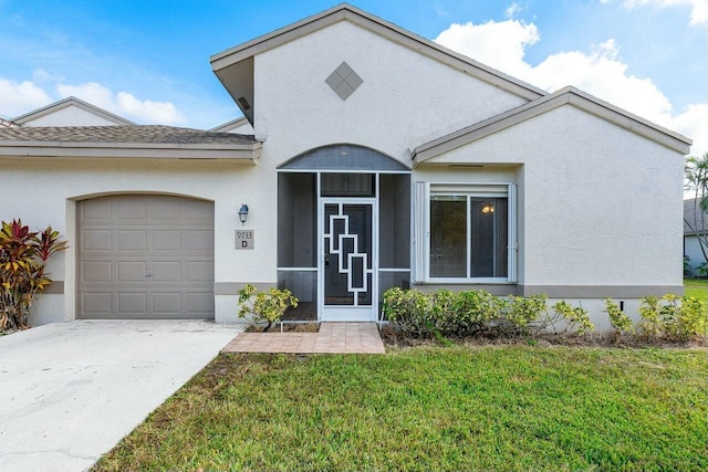 view of front of home featuring a garage and a front lawn