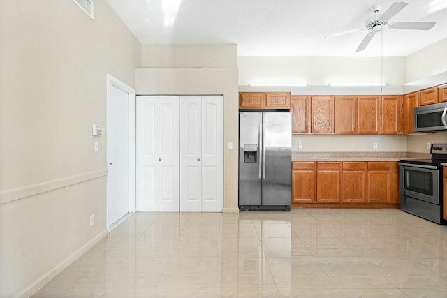 kitchen with ceiling fan and appliances with stainless steel finishes