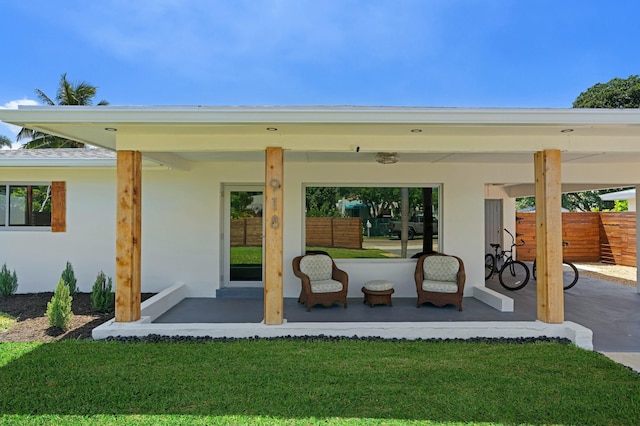 rear view of property featuring a yard