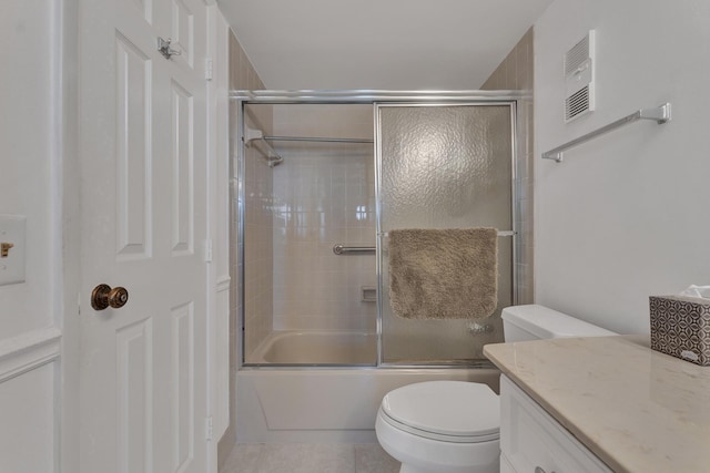 full bathroom with toilet, vanity, tile patterned floors, and shower / bath combination with glass door