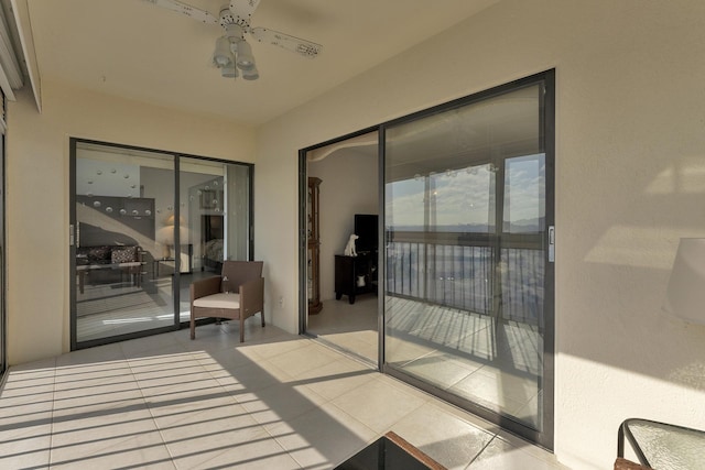 interior space featuring ceiling fan and a patio area