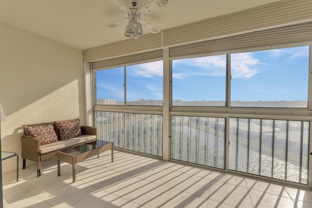 sunroom featuring ceiling fan