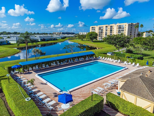 view of swimming pool featuring a water view