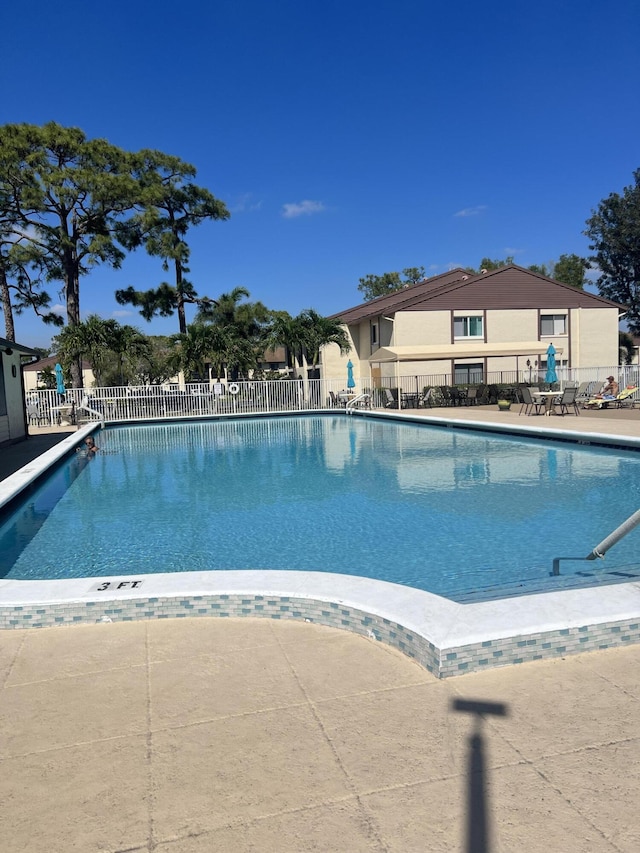 view of swimming pool featuring a patio area