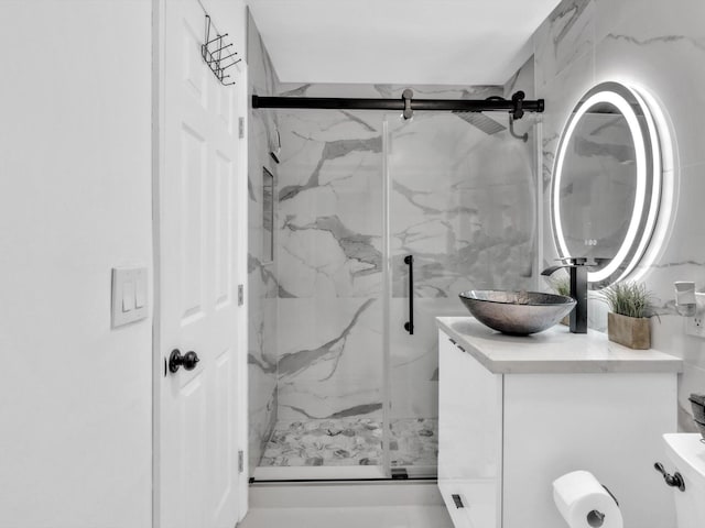 bathroom featuring vanity and walk in shower