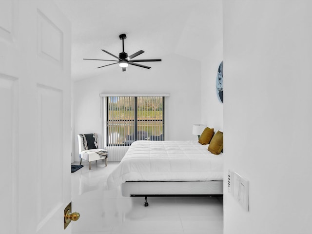 tiled bedroom featuring vaulted ceiling and ceiling fan