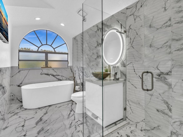 full bathroom featuring a textured ceiling, shower with separate bathtub, toilet, vanity, and tile walls