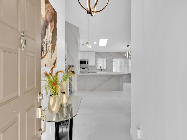 interior space featuring a skylight and sink