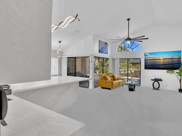 living room featuring high vaulted ceiling and ceiling fan