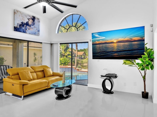 living room with ceiling fan and lofted ceiling