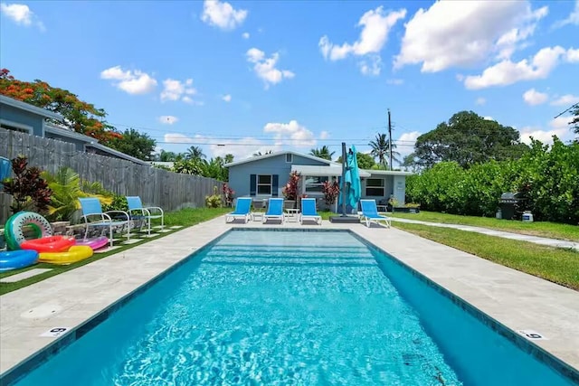 view of swimming pool with a patio area