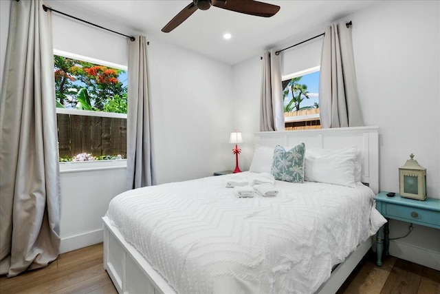 bedroom featuring ceiling fan and light wood-type flooring