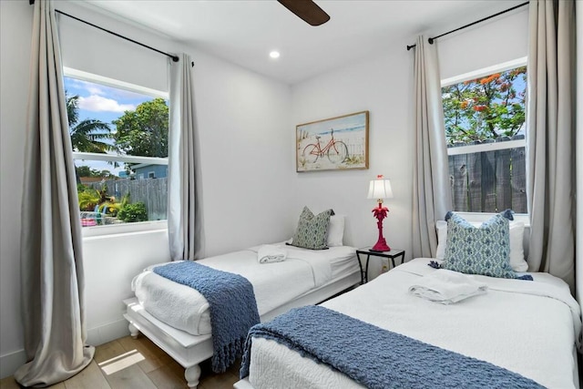 bedroom featuring wood-type flooring and ceiling fan