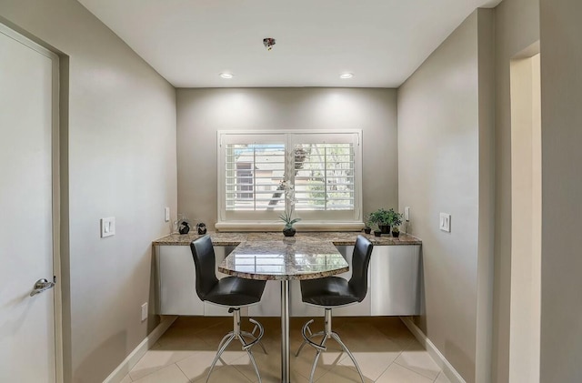 dining area with light tile patterned flooring