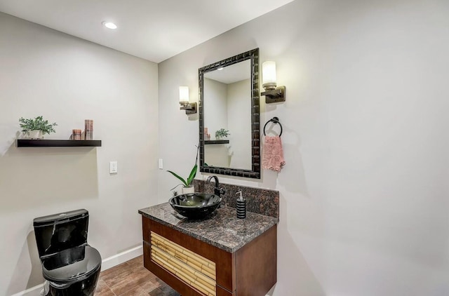 bathroom featuring vanity and wood-type flooring